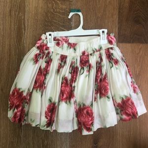 Rose adorned white mini skirt